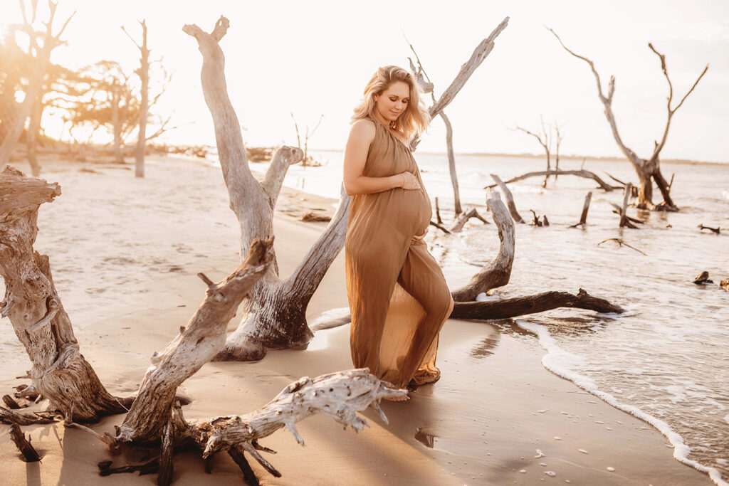 Pregnant mother poses for Maternity Portraits at Folly Beach in Charleston, SC.