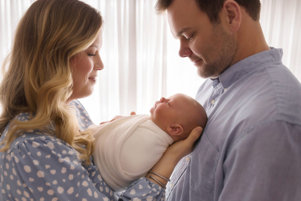 Holy City Babies Newborn Photography Studio in Charleston, SC offers a Full Service, Luxury Portrait Experience including selection of collection of archival artwork including professionally framed wall art, gallery-wrapped canvases, handcrafted heirloom albums, archival image folio boxes featuring matted fine art prints, keepsake print boxes, tabletop acrylic photo blocks, professionally matted gift prints, and custom-designed holiday cards and birth announcements, which is Why Your Baby's Newborn Portraits Deserve to be Displayed.