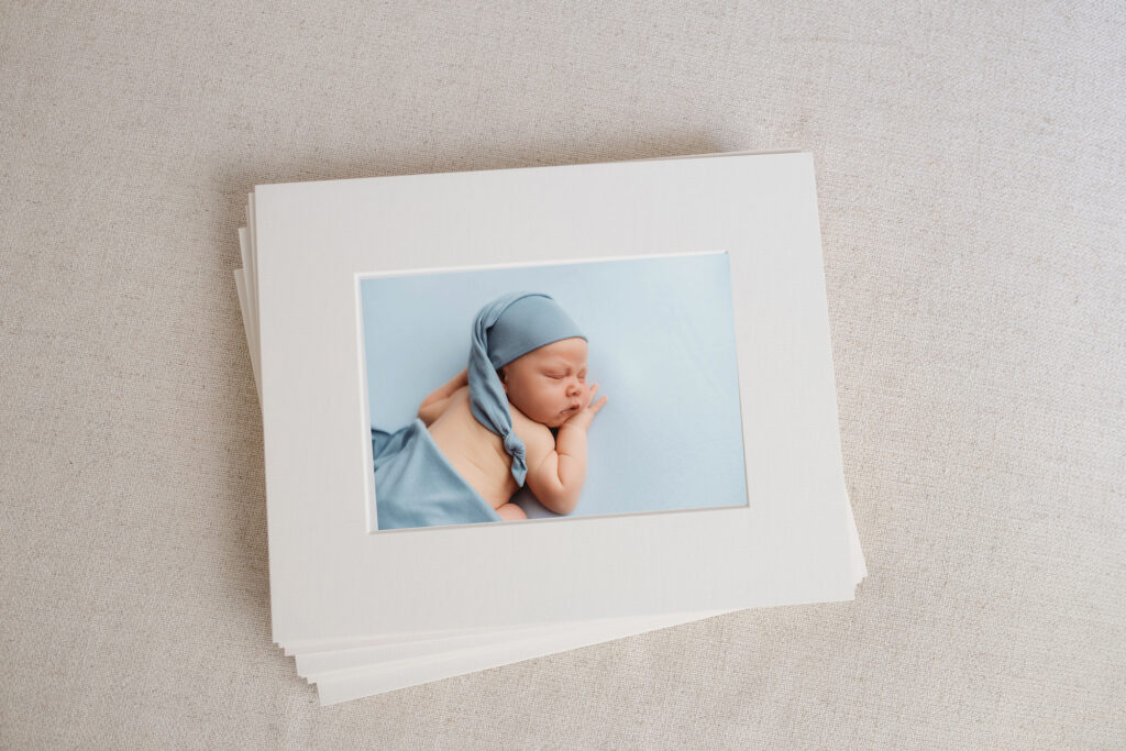 Holy City Babies Newborn Photography Studio in Charleston, SC offers a Full Service, Luxury Portrait Experience including selection of collection of archival artwork including professionally framed wall art, gallery-wrapped canvases, handcrafted heirloom albums, archival image folio boxes featuring matted fine art prints, keepsake print boxes, tabletop acrylic photo blocks, professionally matted gift prints, and custom-designed holiday cards and birth announcements.