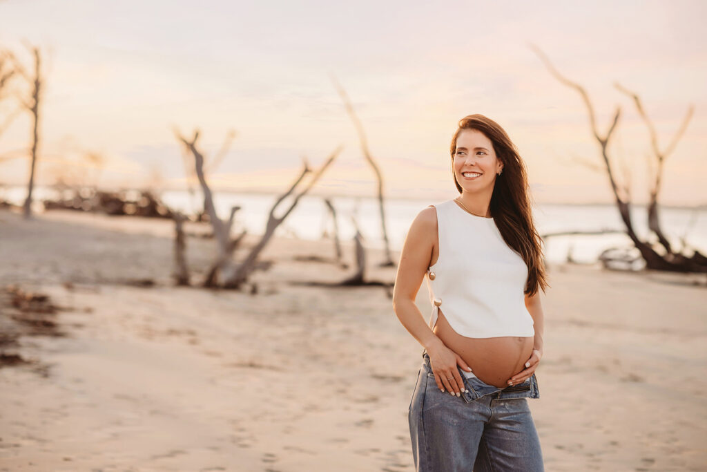 Expectant Mother poses for Maternity Photos on Folly beach in Charleston, SC.