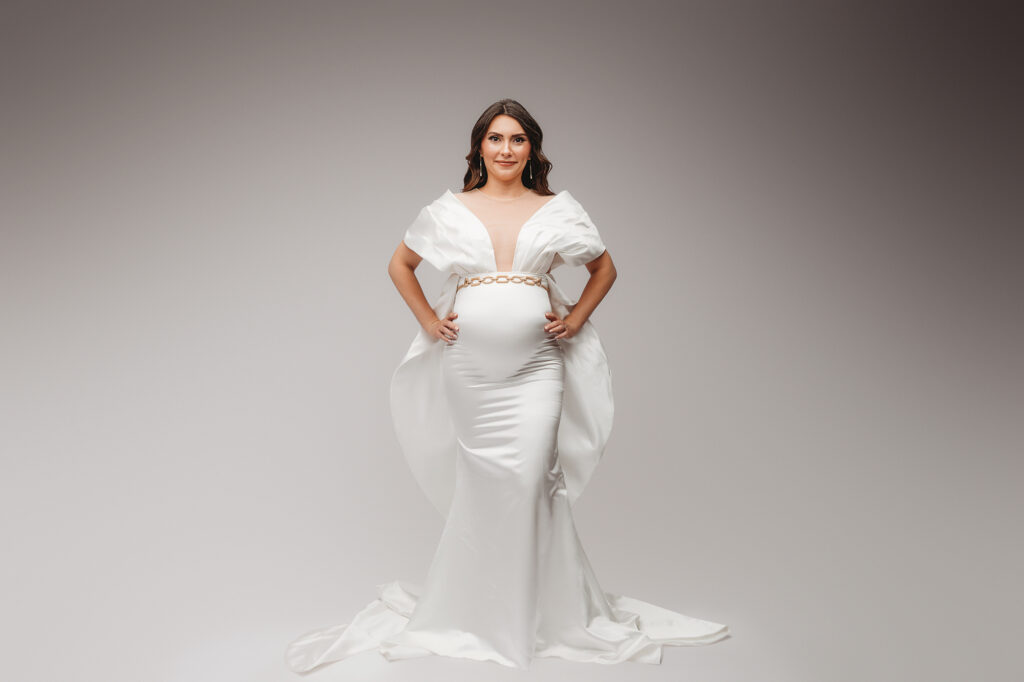 Pregnant woman poses for Studio Maternity Portraits in Charleston during her Babymoon after discovering The Ultimate Charleston Babymoon Planning Guide.