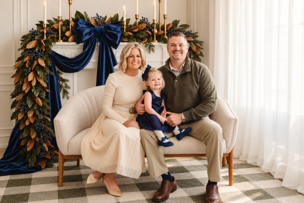 Family poses together for Holiday Mini Sessions in Charleston at Holy City Babies Portrait Studio in the Avondale neighborhood of Charleston.