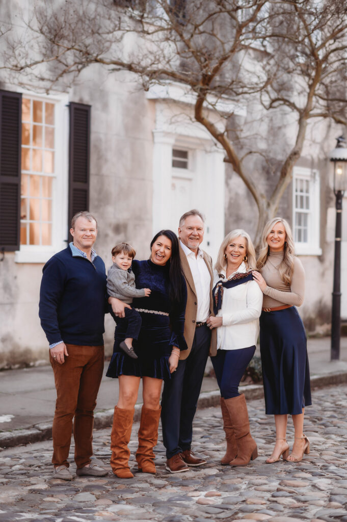 Family poses together during Downtown Charleston Holiday Mini Sessions.