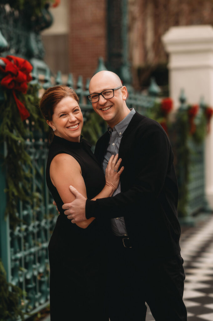 Couple embraces during during Downtown Charleston Holiday Mini Sessions.