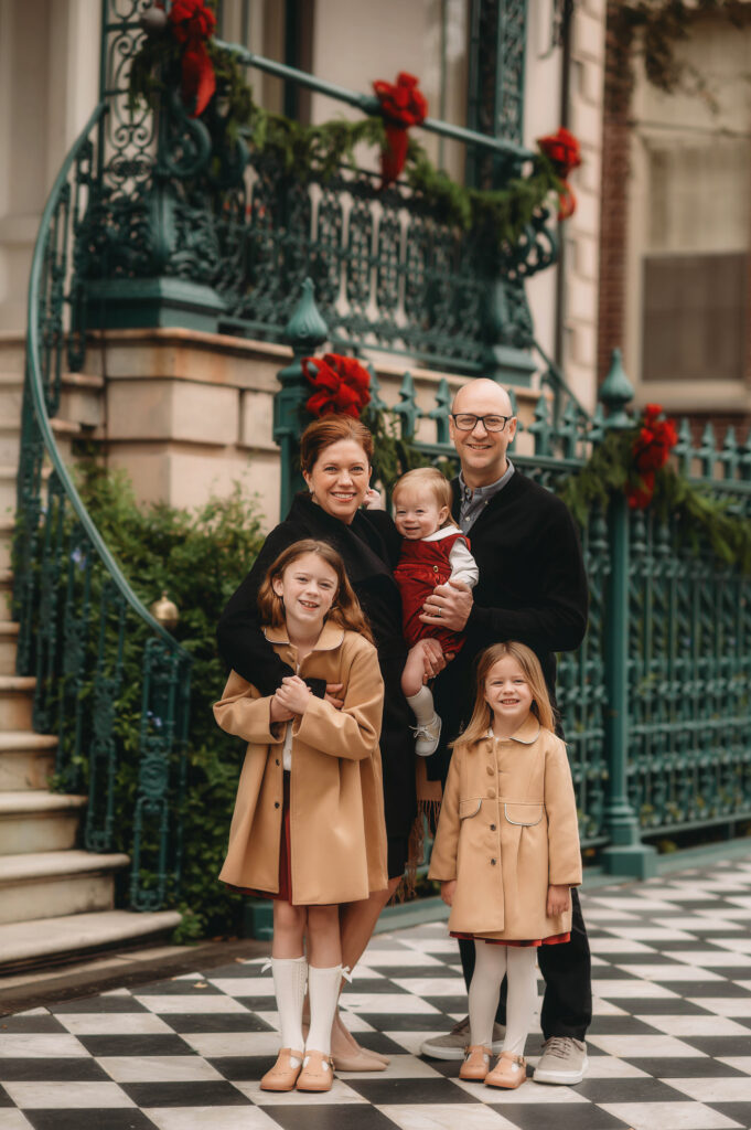 Family poses together for Downtown Charleston Holiday Mini Sessions. 